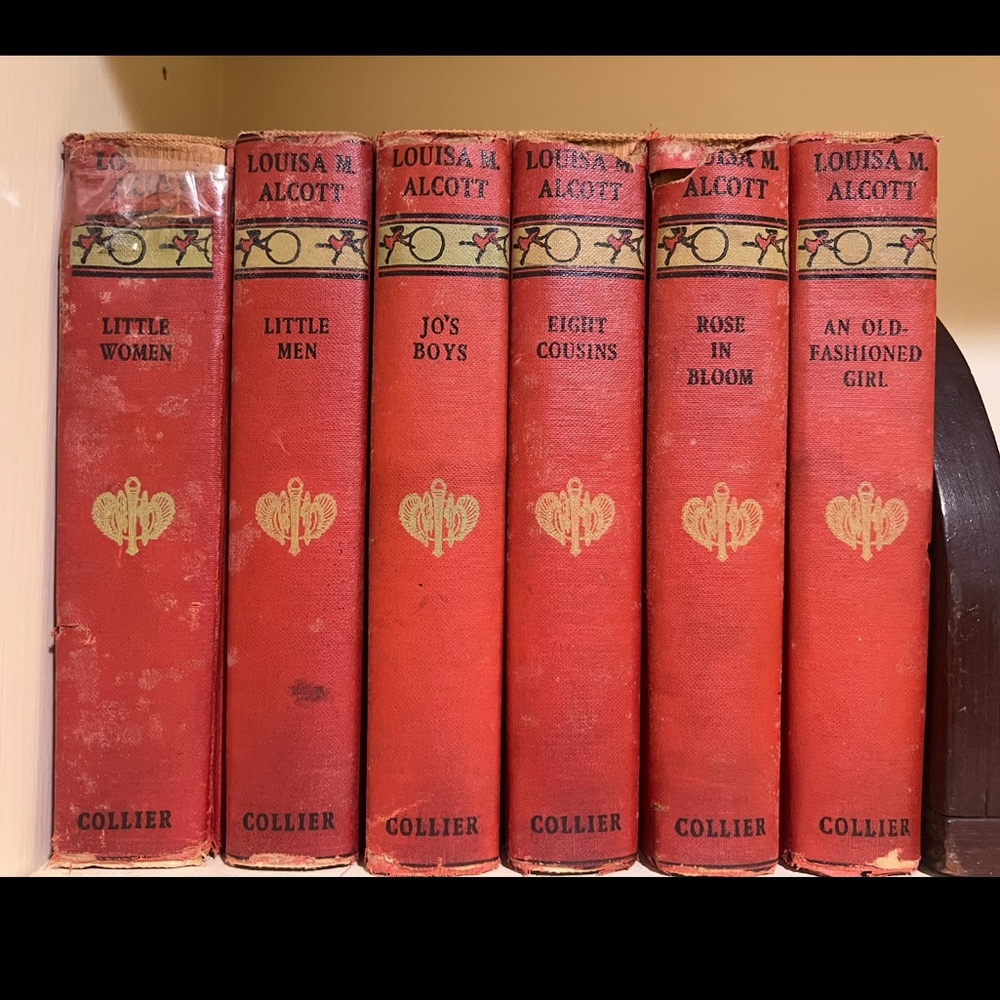 Red Coffee Table Books with Gold Detailing and Textured Covers